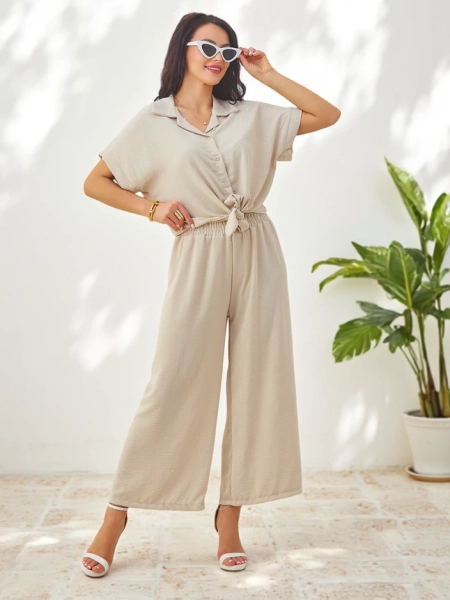 Royalfashion Women's set with a tied short-sleeve shirt and flared pants with rhinestones