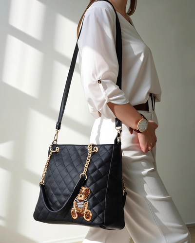 Royalfashion Quilted women's handbag made of eco-leather with a bear