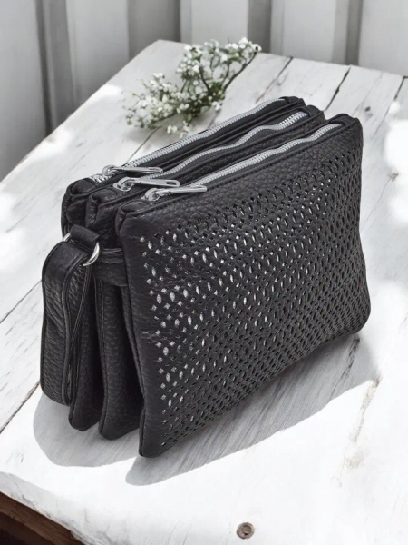 Royalfashion Perforated small women's handbag made of eco leather with 3 compartments