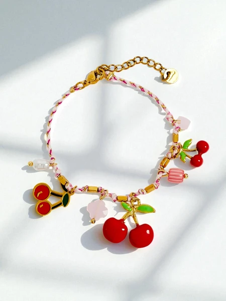 Calista Cerise bracelet with cherry charms on a gold-plated string
