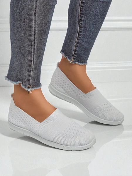 White Ariadne women's ballerinas made of breathable fabric on a flat sole