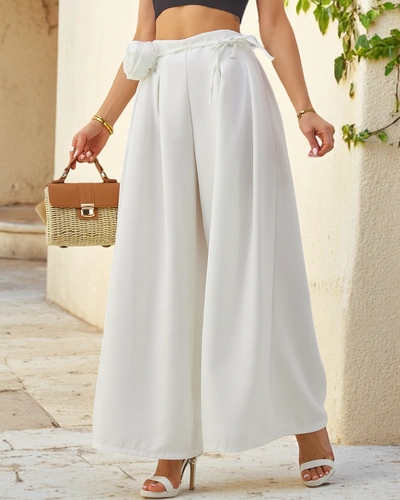 Royalfashion Elegant wide women's trousers with a decorative flower by the belt